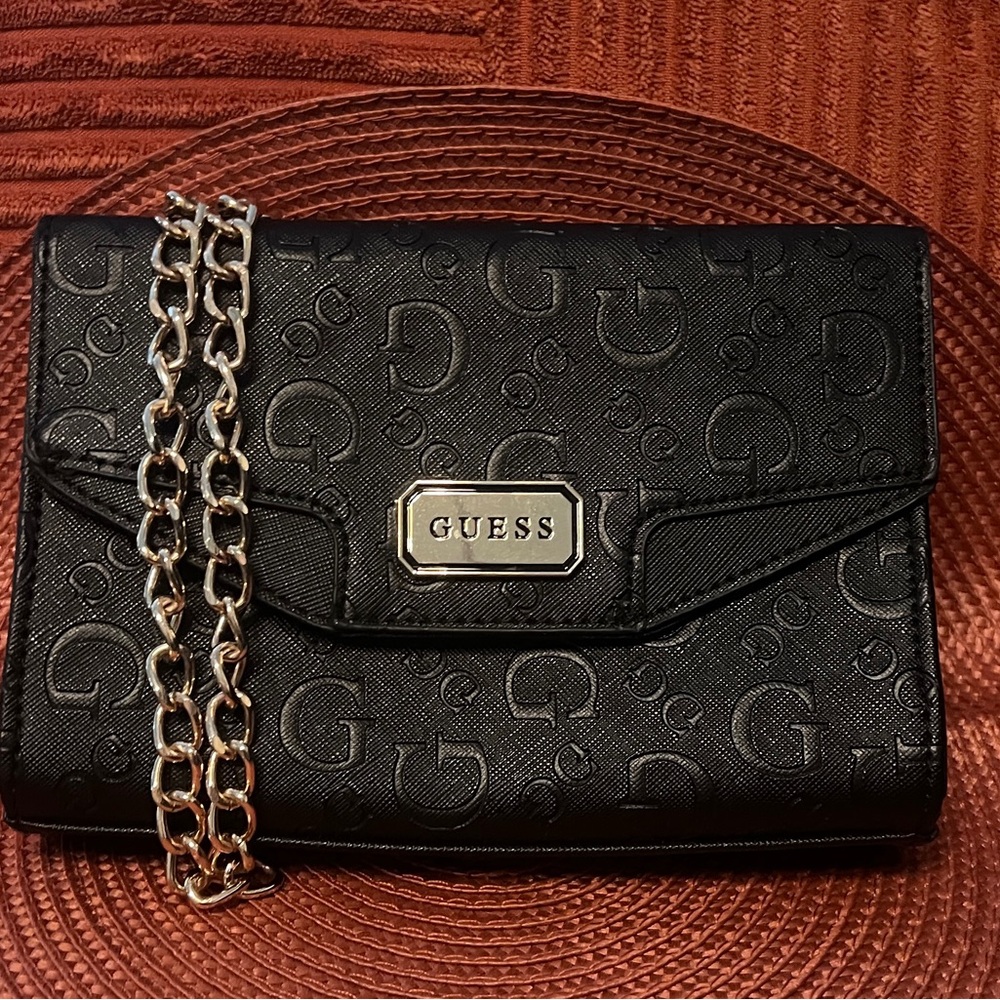 Guess fold over crossbody .